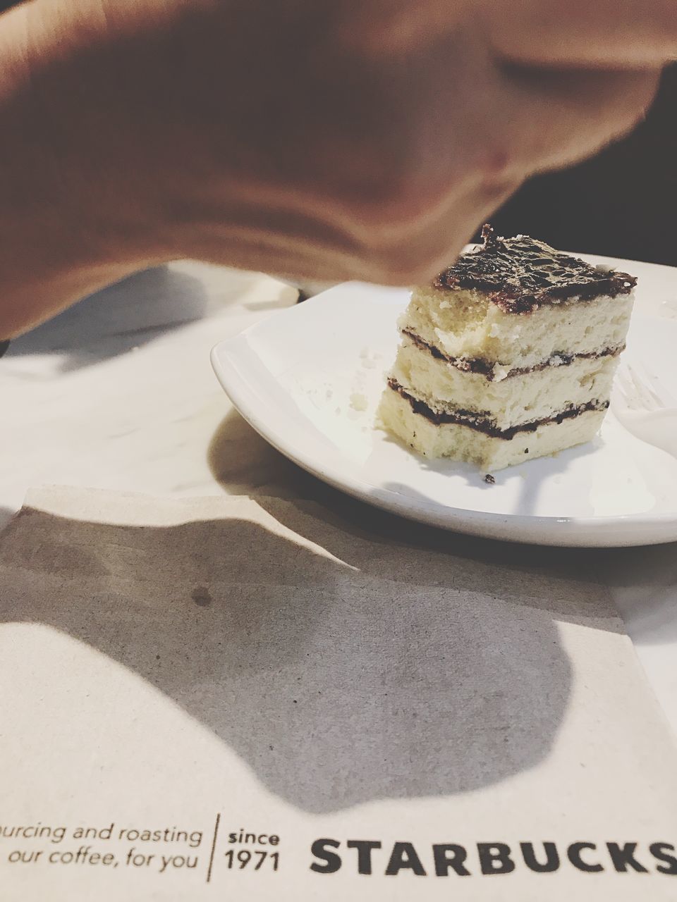 food and drink, food, indoors, one person, plate, real people, shadow, temptation, close-up, indulgence, sweet food, freshness, human hand, human body part, ready-to-eat, day, people