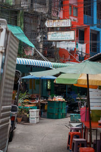 Street market against buildings in city