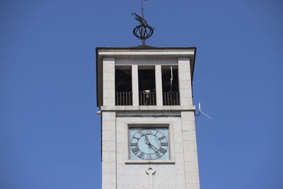 Low angle view of clock tower against sky