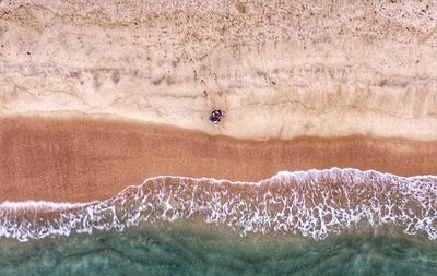Couple seen from above on beach