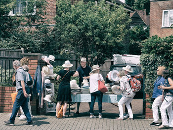 Group of people against building