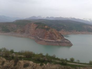 Scenic view of landscape and mountains against sky