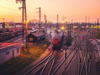 High angle view of railroad station against sky during sunset