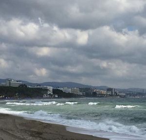 Scenic view of sea against cloudy sky