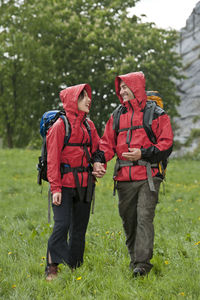 Couple hiking in the rain in england