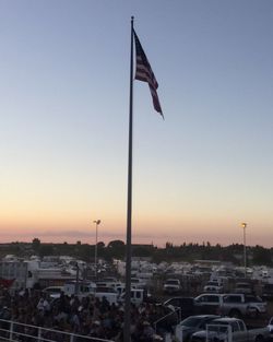 Flag against clear sky during sunset