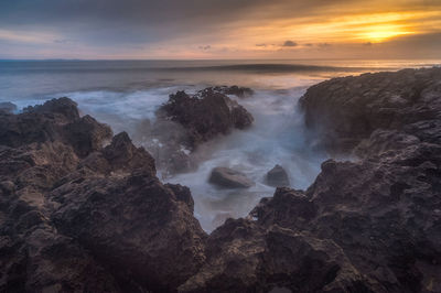 Scenic view of sea against sky during sunset