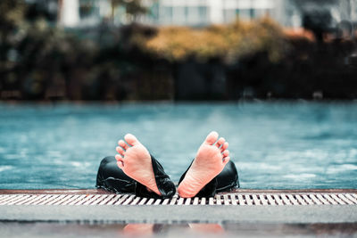 Low section of person in swimming pool