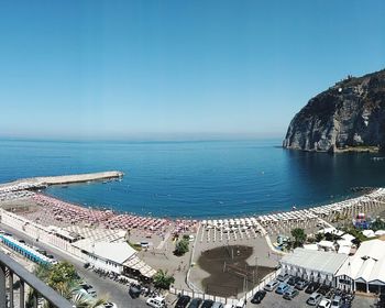 High angle view of sea against clear blue sky