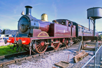 Train on railroad tracks against sky