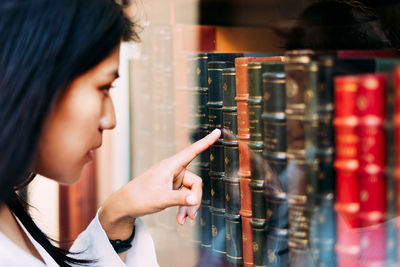 Close-up of woman looking at books