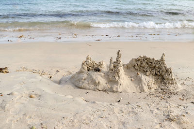 Sand castle on the beach, men du beach in carnac, brittany, france