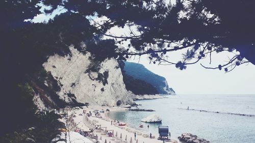 Scenic view of sea with mountain in background