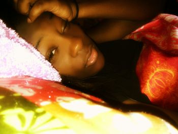 Close-up portrait of girl sleeping on bed