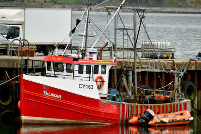 Fishing boat moored at harbor