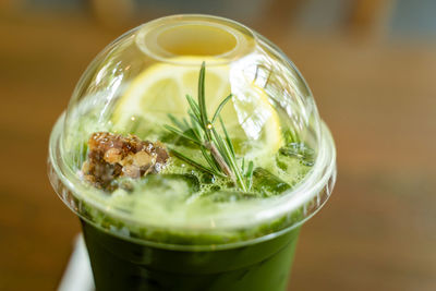 Close-up shot of delicious honey lemon green tea drink