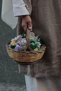 Cropped hand of person holding rope