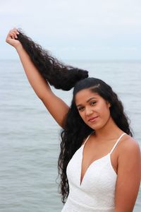 Portrait of young woman in sea