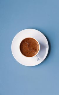 Directly above shot of coffee on blue background