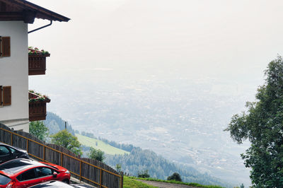 Scenic view of mountains and buildings against sky