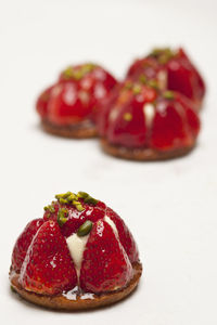 Group of strawberry tarts on white background