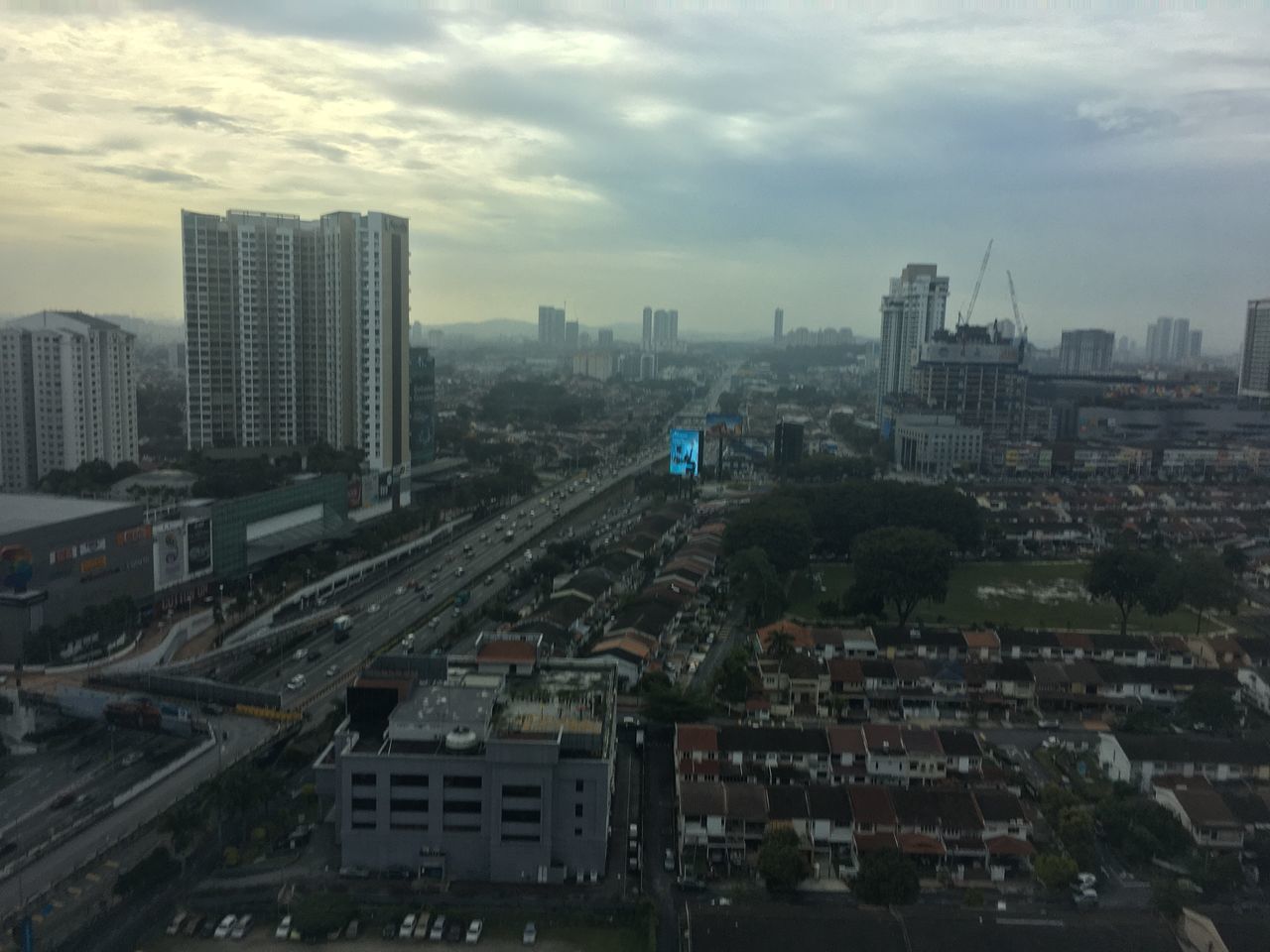 HIGH ANGLE VIEW OF CITY BUILDINGS AGAINST SKY