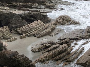 High angle view of rocks in sea