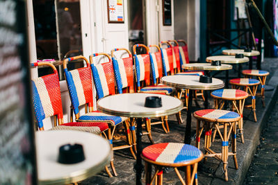 Empty chairs and tables in cafe