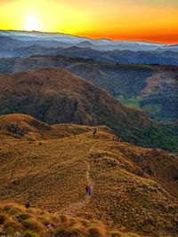 Scenic view of landscape against sky during sunset