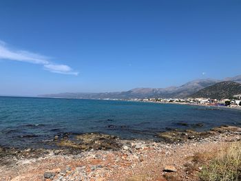 Scenic view of sea against blue sky