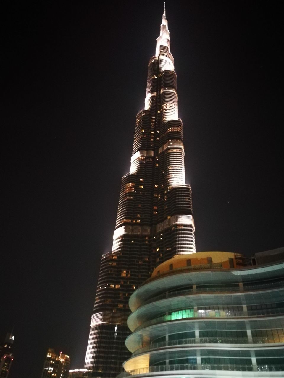 architecture, building exterior, tall - high, built structure, night, modern, travel destinations, low angle view, illuminated, tourism, skyscraper, city, no people, sky, outdoors
