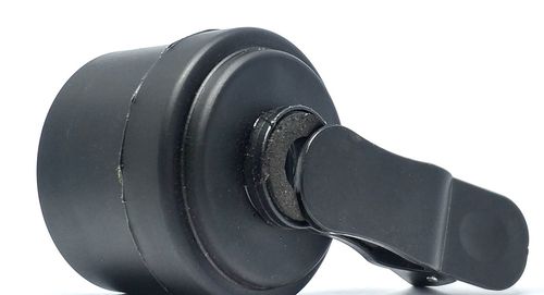 Close-up of camera against white background