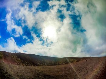 Panoramic shot of road amidst land against sky