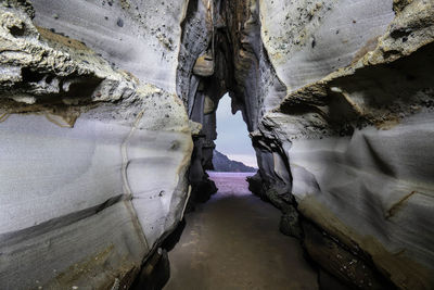 View of rock formations in sea