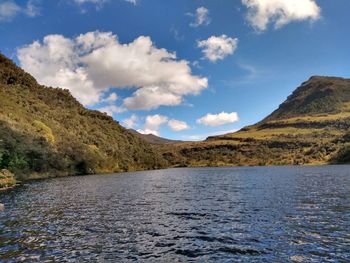 Scenic view of lake and mountains against sky