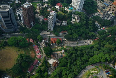 Aerial view of man base jumping over city