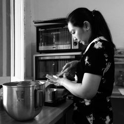 Side view of a woman at home