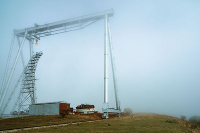 Low angle view of cable car against sky