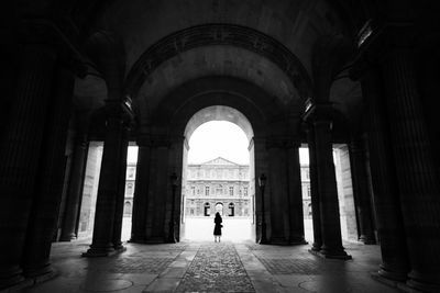 Woman standing in corridor