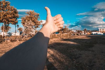 Midsection of person against sky in city