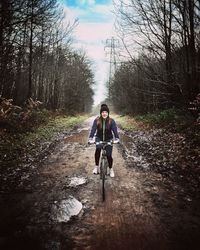 Man riding bicycle on road