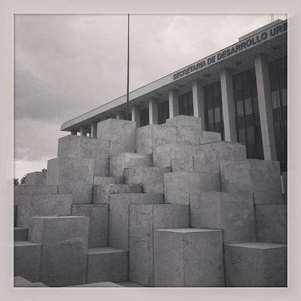 architecture, built structure, building exterior, sky, low angle view, history, transfer print, cloud - sky, auto post production filter, cloud, building, old, day, outdoors, cloudy, the past, stone wall, no people, window, famous place