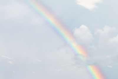 Low angle view of rainbow in sky