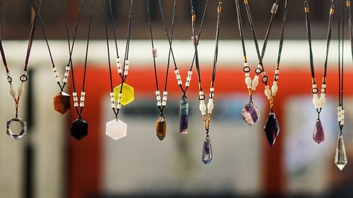 Low angle view of decoration hanging for sale at market