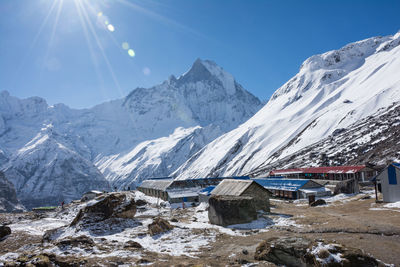 Scenic view of snowcapped mountains against sky