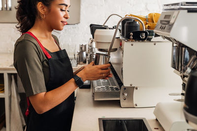 Side view of woman working