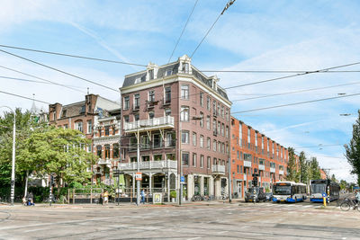 Street amidst buildings against sky