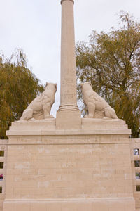 Low angle view of statue against sky