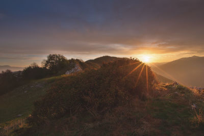 Scenic view of landscape against sky during sunset