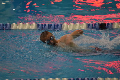 Young swimmer in swimming pool